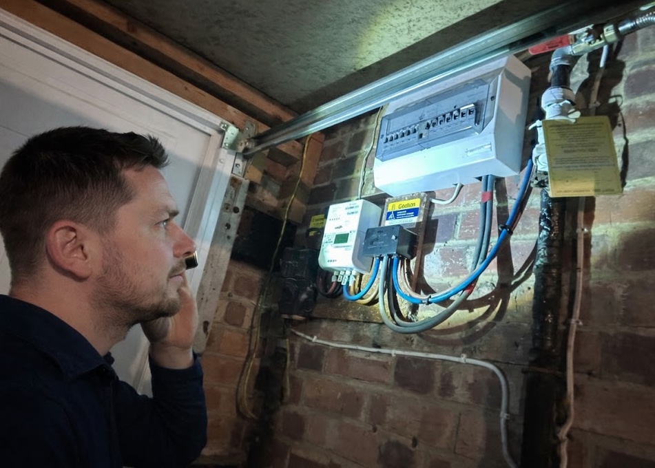 Engineer inspecting a consumer unit